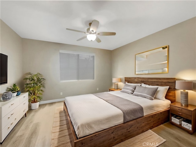 bedroom featuring light hardwood / wood-style floors and ceiling fan