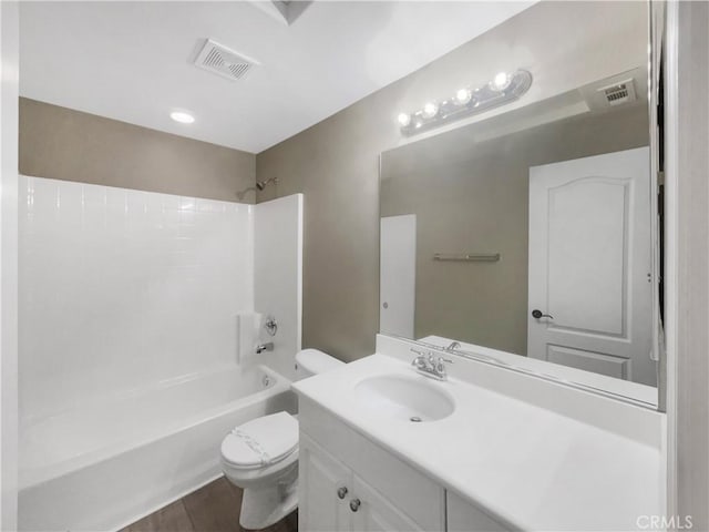 full bathroom with vanity, shower / washtub combination, and toilet