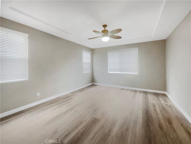 unfurnished room with hardwood / wood-style floors and ceiling fan