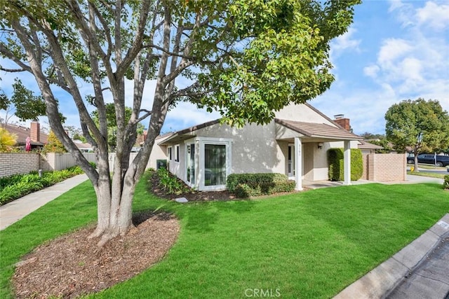 view of front of home with a front yard