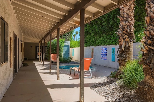 view of patio featuring a fenced in pool