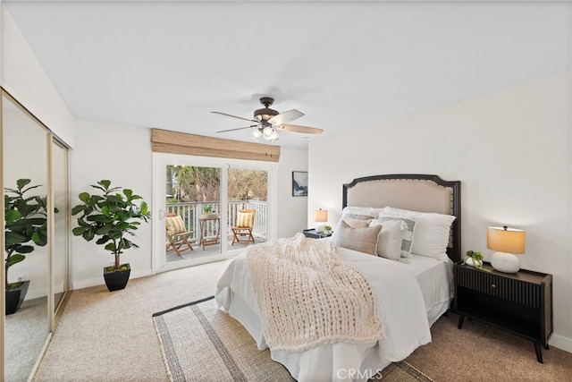 carpeted bedroom with access to exterior, ceiling fan, and a closet