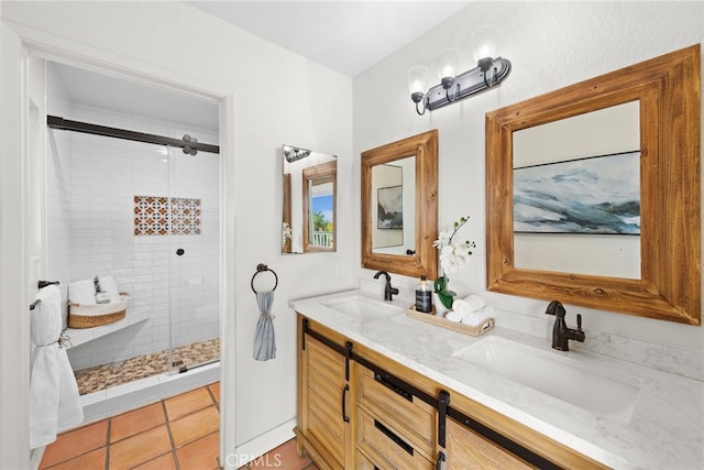 bathroom featuring walk in shower, vanity, and tile patterned flooring