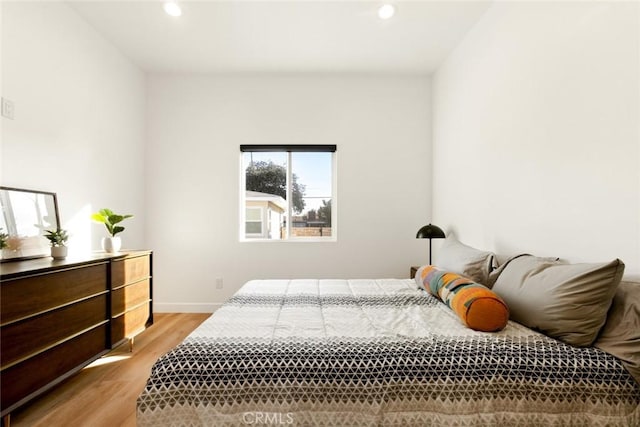 bedroom with baseboards, light wood-style flooring, and recessed lighting