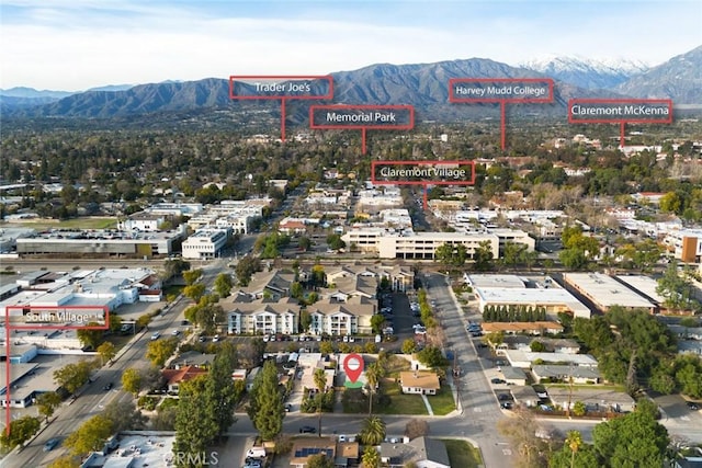 birds eye view of property featuring a mountain view