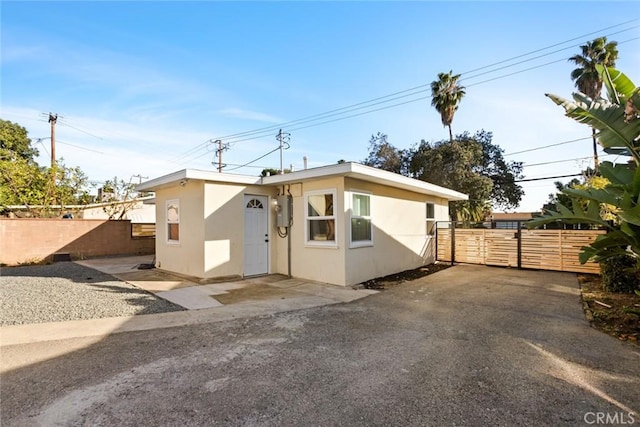 exterior space with fence and stucco siding