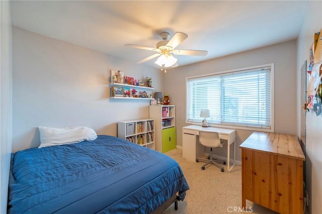 bedroom featuring ceiling fan and light carpet