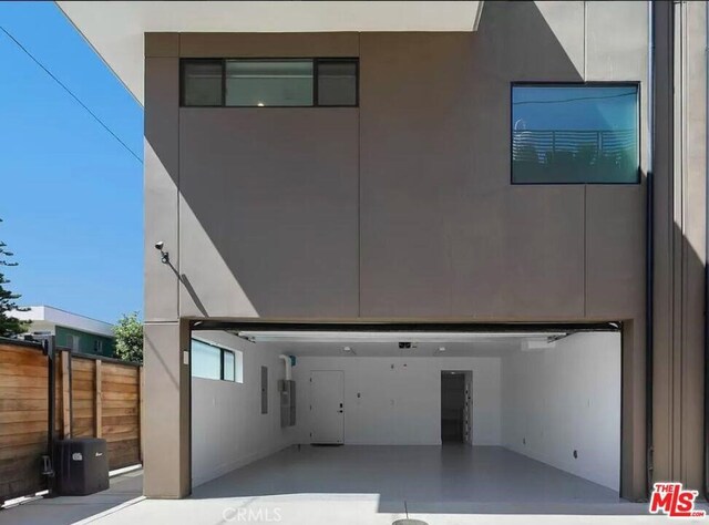 1304 N Mansfield Ave, Los Angeles, CA 90028 - view of front of home with an attached garage and electric panel