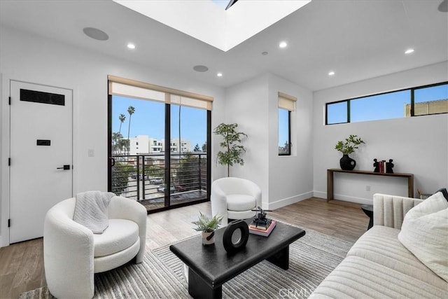 1304 N Mansfield Ave, Los Angeles, CA 90028 - living area with light wood-style floors, baseboards, and recessed lighting