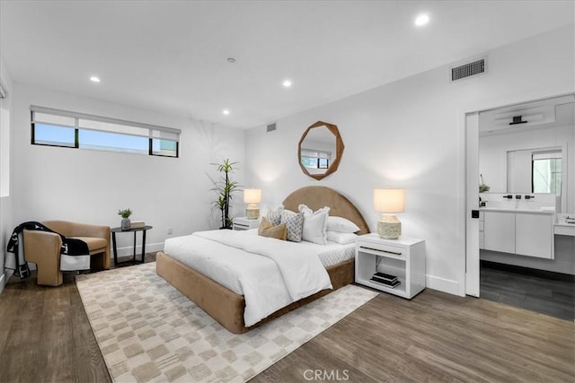 1304 N Mansfield Ave, Los Angeles, CA 90028 - bedroom featuring recessed lighting, wood finished floors, multiple windows, baseboards, and ensuite bath