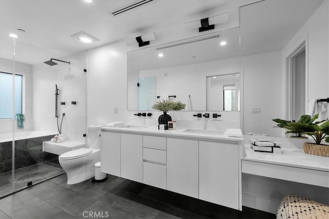 1304 N Mansfield Ave, Los Angeles, CA 90028 - bathroom featuring a stall shower, toilet, double vanity, and recessed lighting