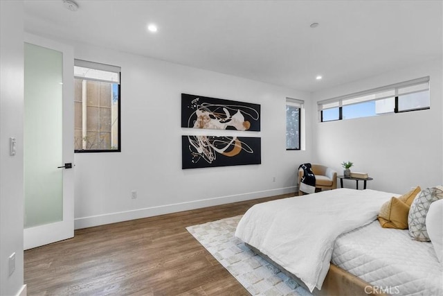 1304 N Mansfield Ave, Los Angeles, CA 90028 - bedroom with wood finished floors, recessed lighting, and baseboards