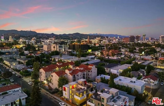 1304 N Mansfield Ave, Los Angeles, CA 90028 - aerial view at dusk of a mountain view and a view of city