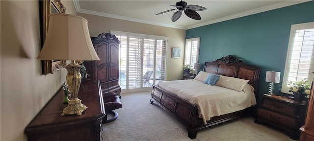 carpeted bedroom featuring crown molding and ceiling fan