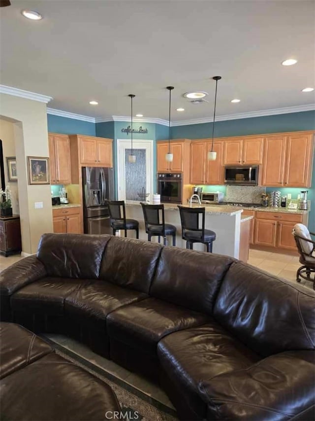 tiled living room featuring ornamental molding