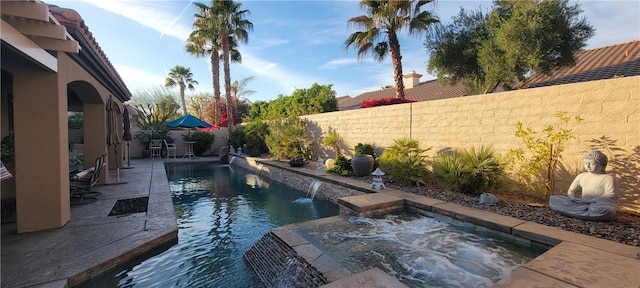 view of pool with a jacuzzi, a patio, a fenced in pool, and a fenced backyard