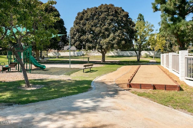 view of community with a yard and a playground