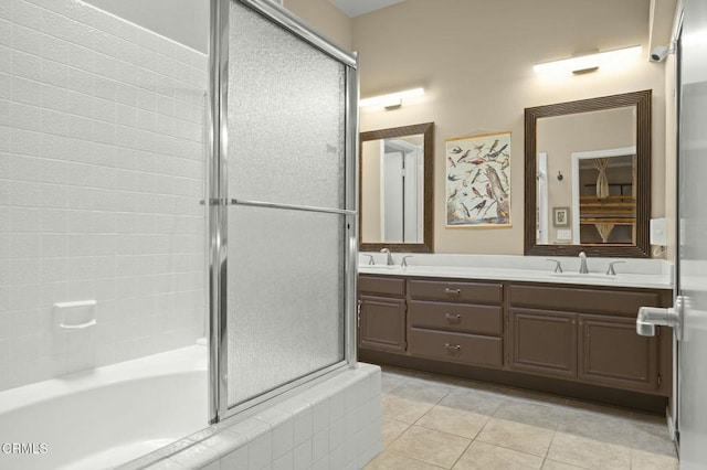 bathroom featuring vanity, bath / shower combo with glass door, and tile patterned floors