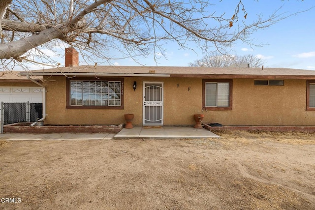 back of property featuring a patio