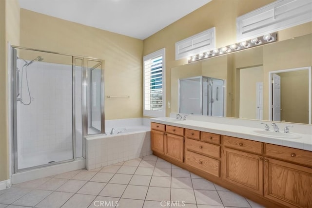 bathroom featuring tile patterned floors, independent shower and bath, and vanity