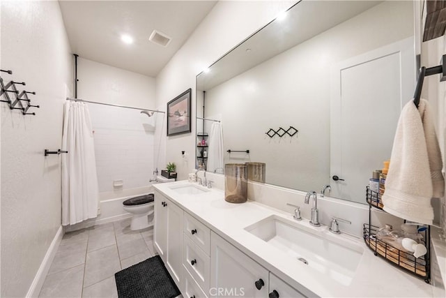 full bathroom with tile patterned flooring, vanity, shower / tub combo, and toilet