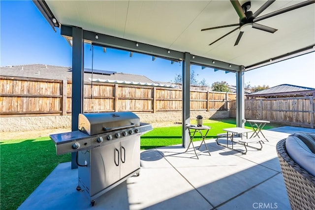 view of patio with a grill and ceiling fan