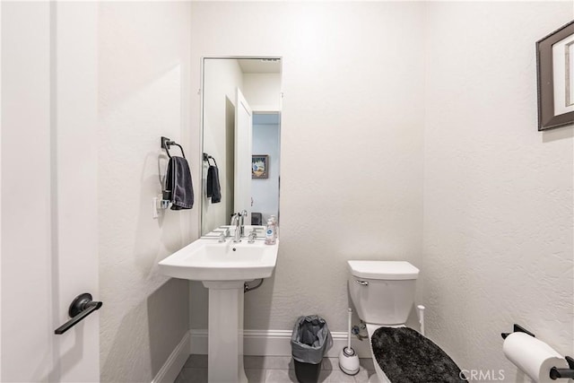 bathroom featuring toilet