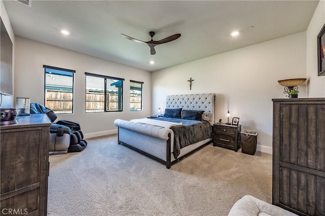 bedroom featuring light carpet and ceiling fan