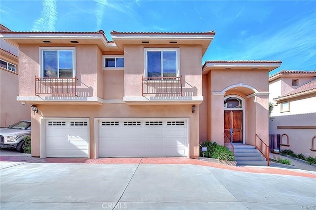 view of front of house with a balcony and a garage