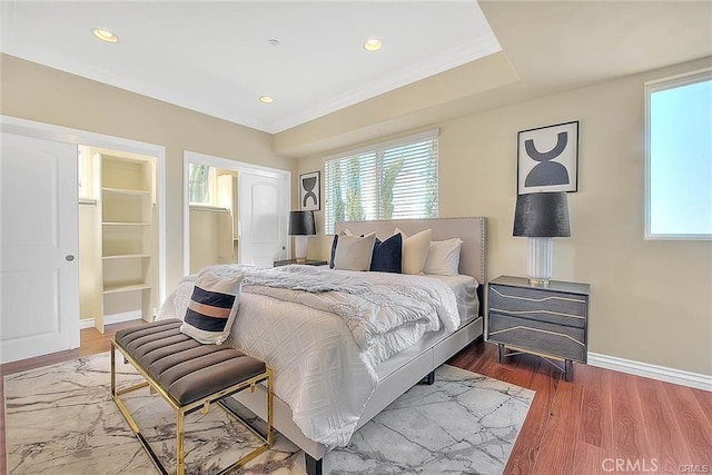 bedroom with hardwood / wood-style floors