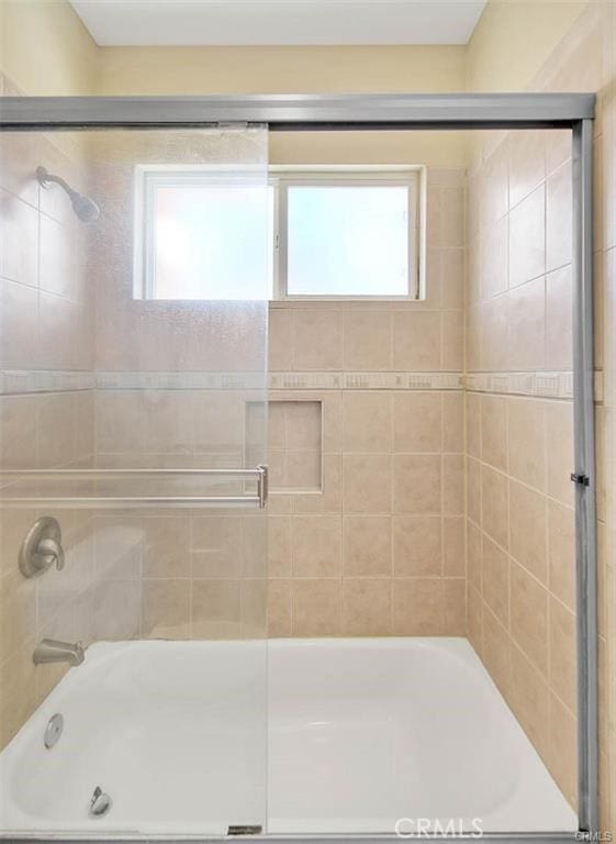 bathroom featuring enclosed tub / shower combo