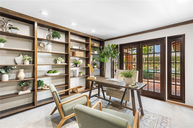 carpeted home office featuring french doors and crown molding