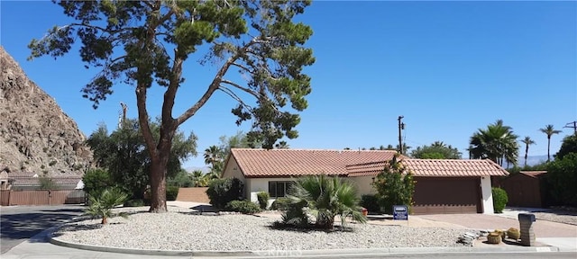 single story home with a garage