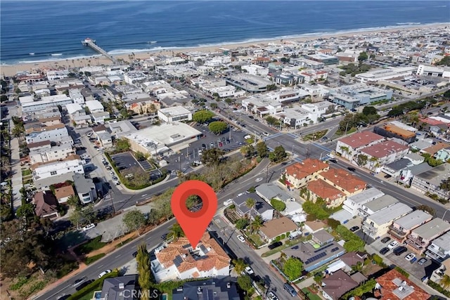 bird's eye view featuring a view of the beach and a water view