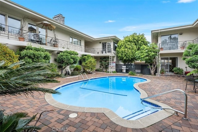 view of pool with a patio area