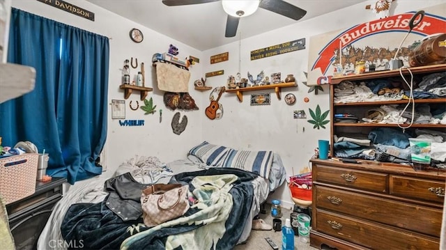 bedroom featuring ceiling fan and carpet