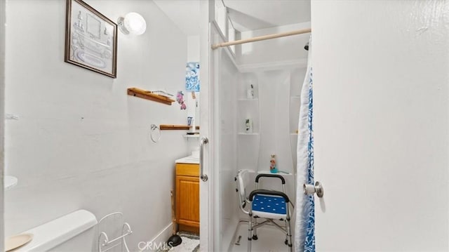 bathroom featuring vanity, toilet, and a shower with shower curtain