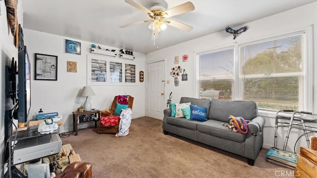 interior space featuring light carpet and ceiling fan