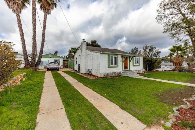 bungalow with a front yard