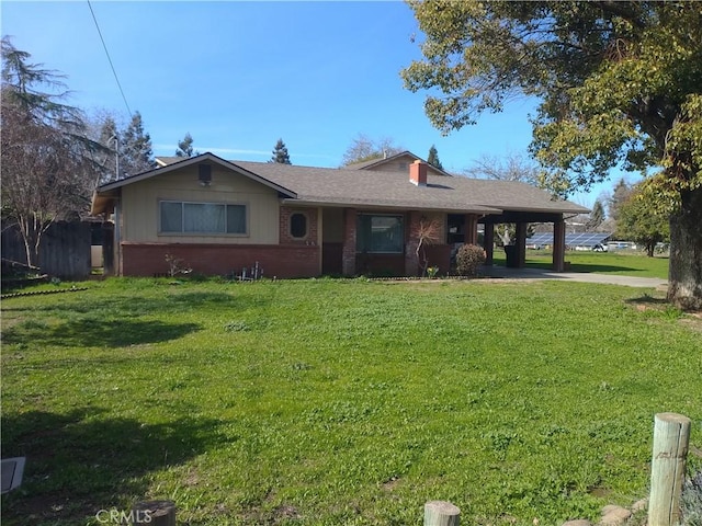 ranch-style house featuring a carport and a front yard