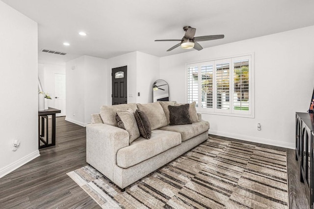 living area with ceiling fan, recessed lighting, dark wood-style flooring, visible vents, and baseboards