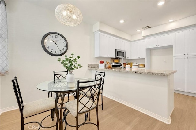 dining room featuring light hardwood / wood-style floors