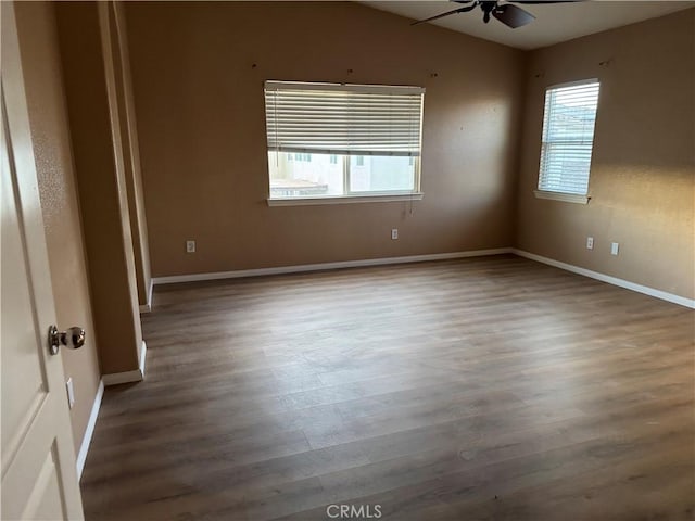 594 Hyacinth Rd, San Jacinto, CA 92582 - empty room featuring ceiling fan, dark hardwood / wood-style floors, and vaulted ceiling