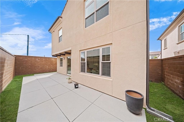 rear view of house with a patio