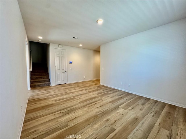 30750 Gazing Star Ln, Murrieta, CA 92563 - spare room with stairs, light wood-type flooring, and recessed lighting