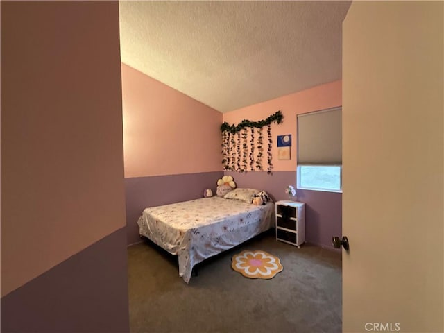 carpeted bedroom with a textured ceiling