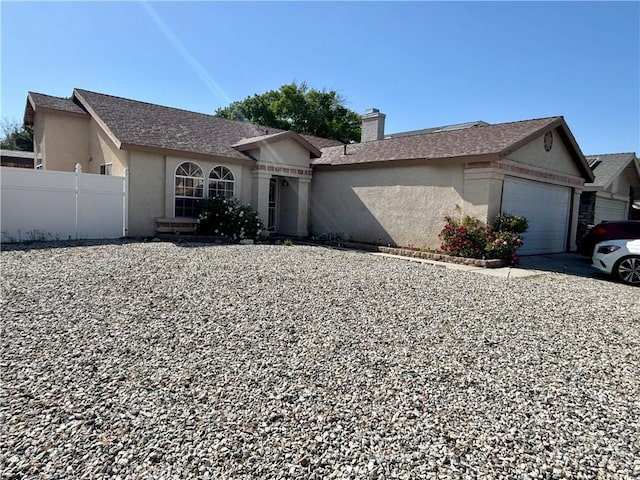44009 17th St E, Lancaster, CA 93535 - ranch-style house with a garage, fence, stucco siding, and a chimney