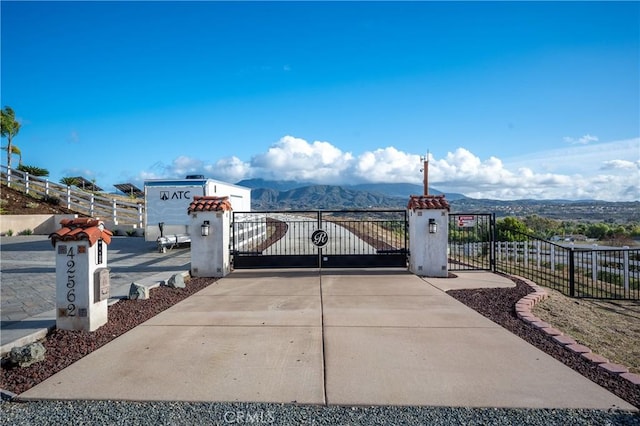 view of gate with a mountain view