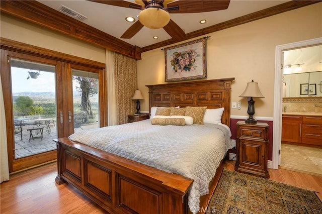 bedroom featuring connected bathroom, light wood-type flooring, access to exterior, crown molding, and beam ceiling