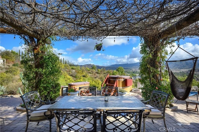 view of patio / terrace with a mountain view